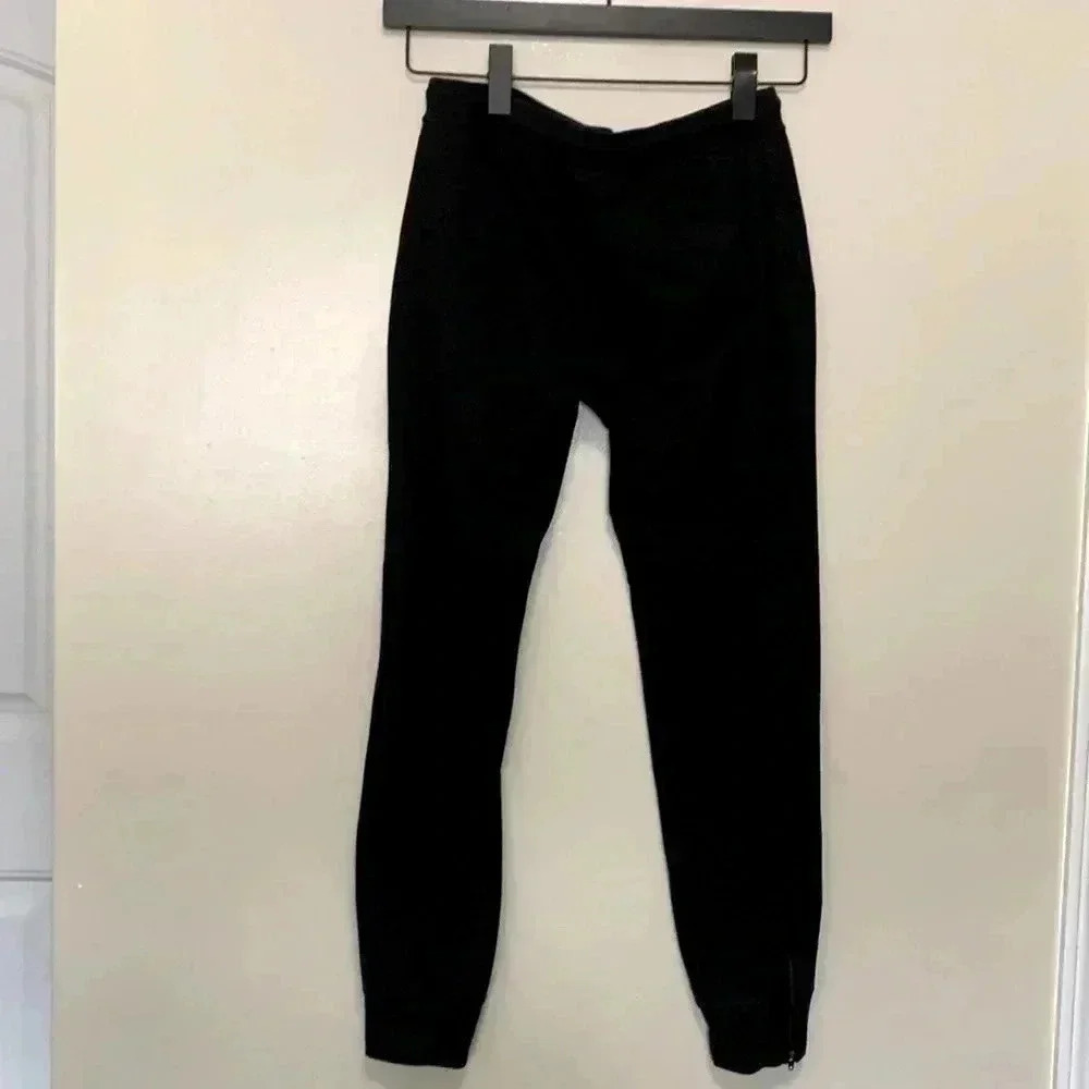 Banana Republic black  sweatpants with zippers at the ankle and a front tie.